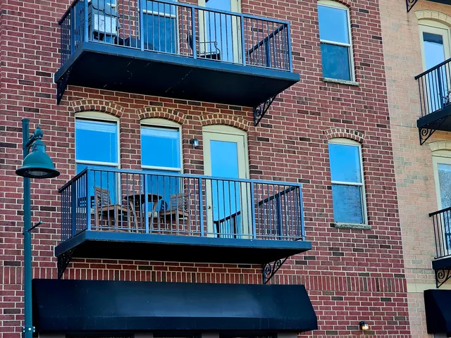 a view of a patio with a table and chairs