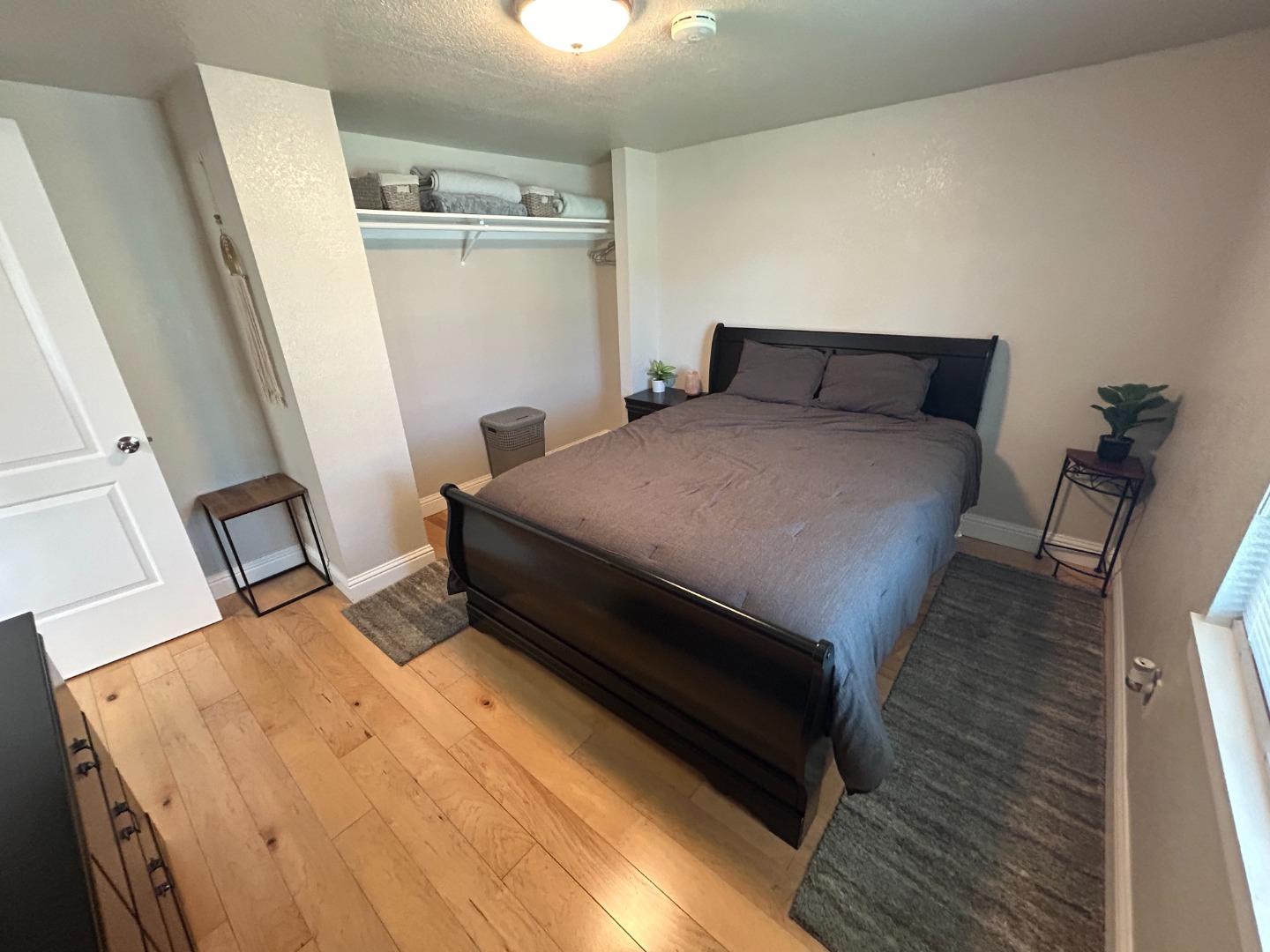 756 1st Street Gilroy, CA 95020 - Photo 12 of 14 a bed sitting in a kitchen with wooden floor