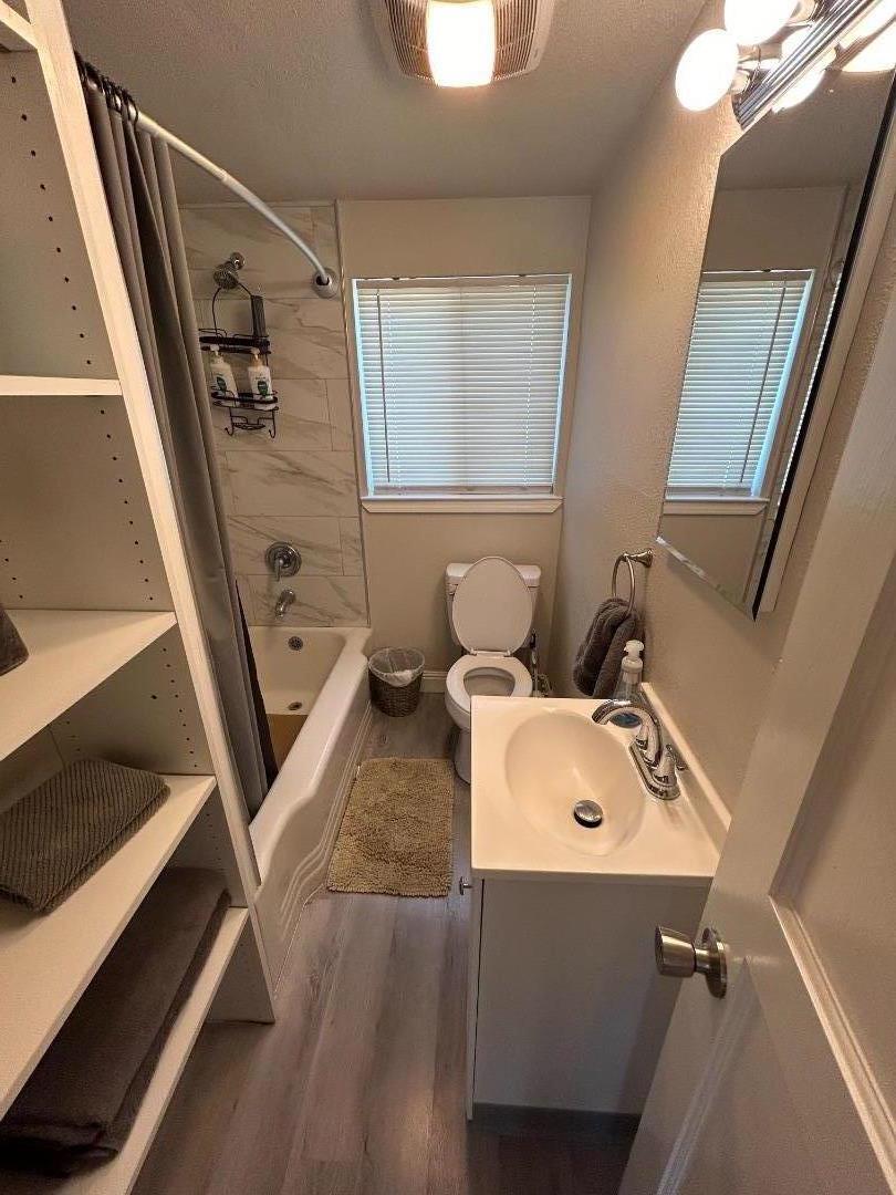 756 1st Street Gilroy, CA 95020 - Photo 13 of 14 a bathroom with a sink mirror and toilet
