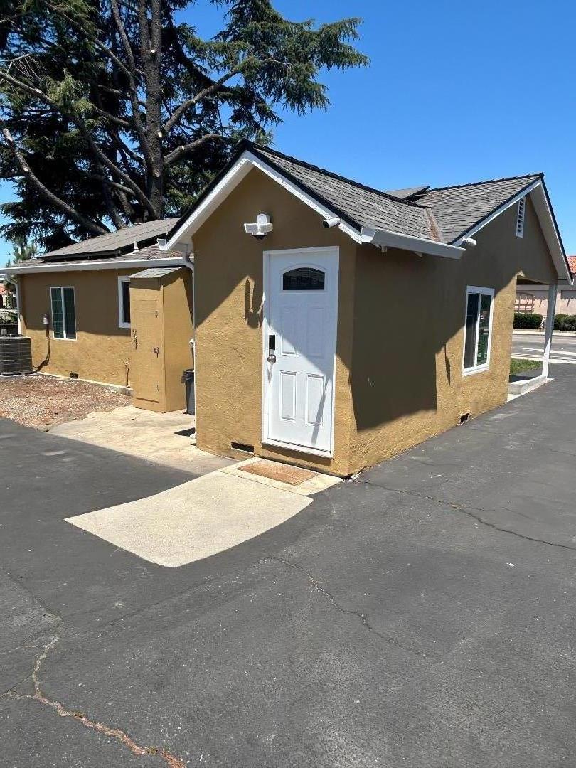 756 1st Street Gilroy, CA 95020 - Photo 5 of 14 a front view of a house with a yard and garage