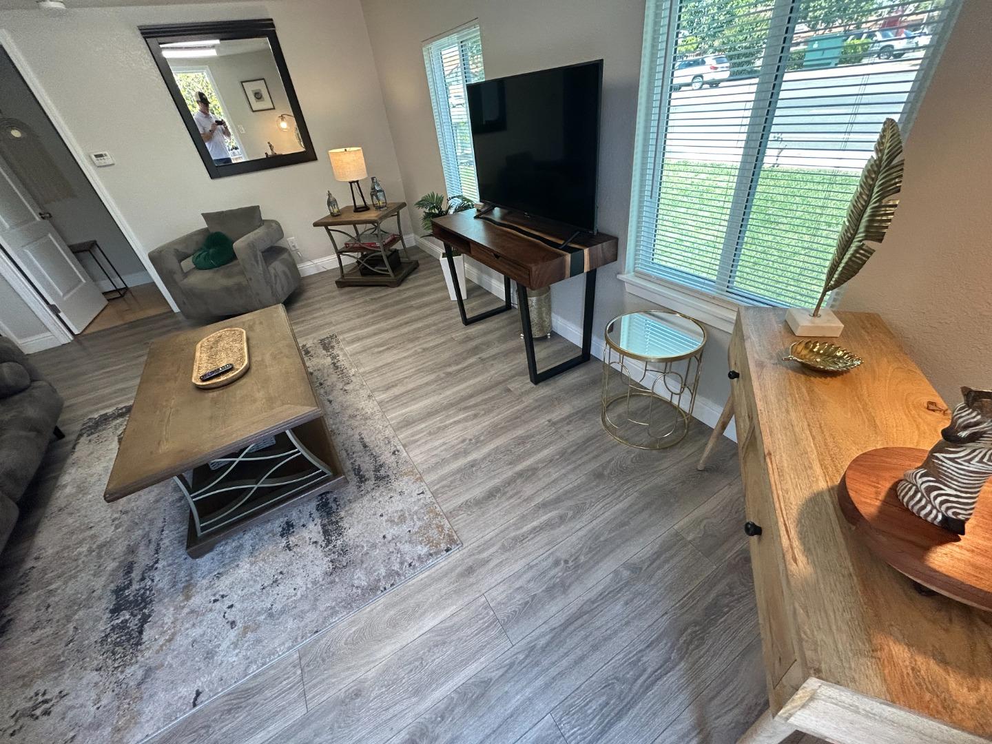 756 1st Street Gilroy, CA 95020 - Photo 6 of 14 a living room with furniture and a flat screen tv