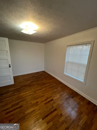 a white bath tub sitting next to a toilet