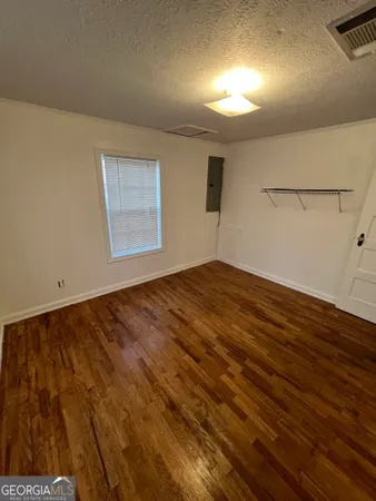 a large kitchen with cabinets and a stove top oven