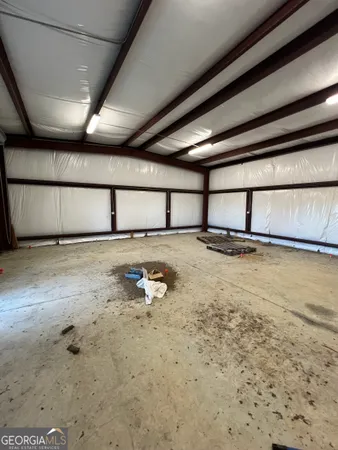 a view of room with wooden floor and cabinet