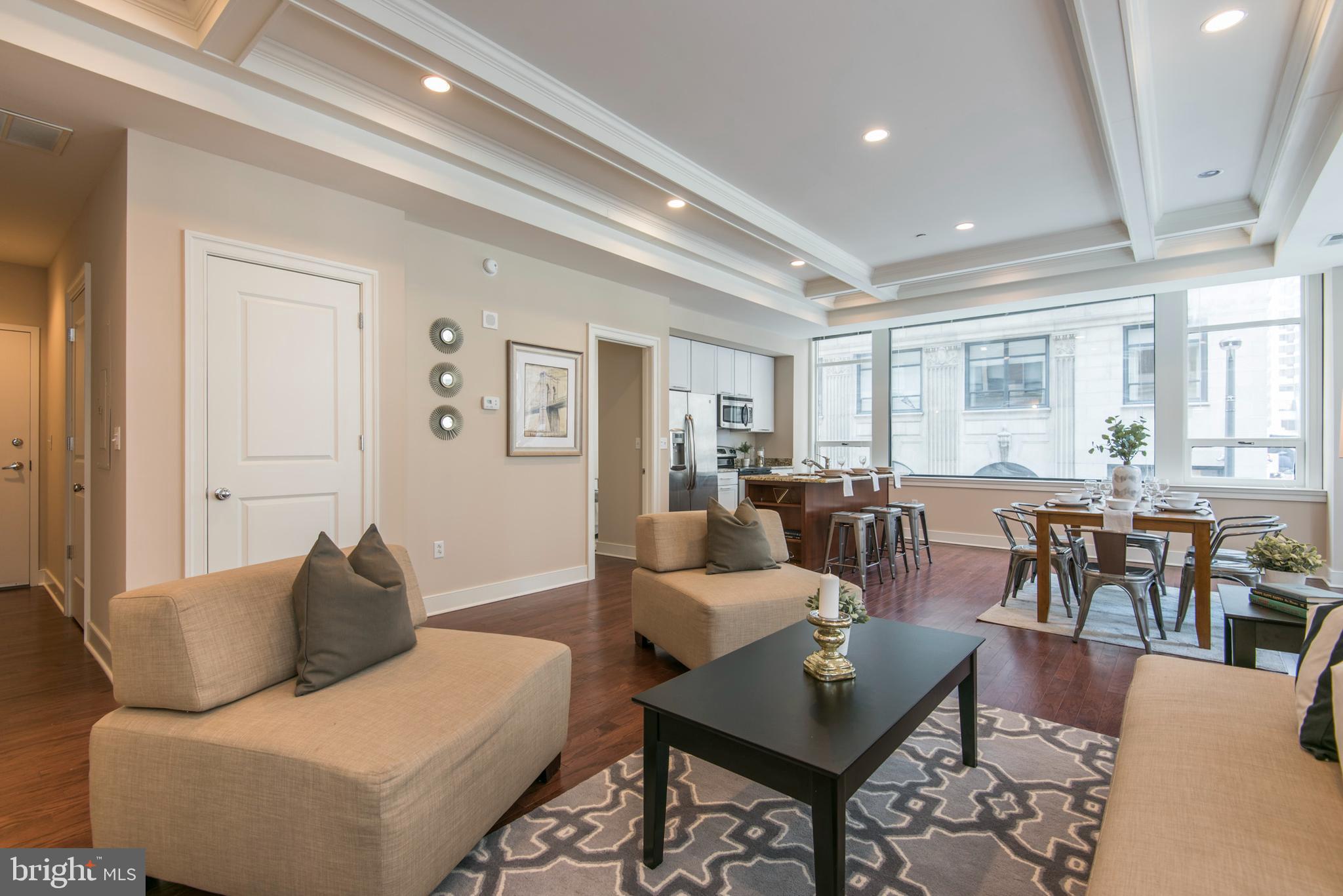 1501 Locust Street, Unit 403 Philadelphia, PA 19102 - Photo 11 of 23 a living room with furniture and wooden floor
