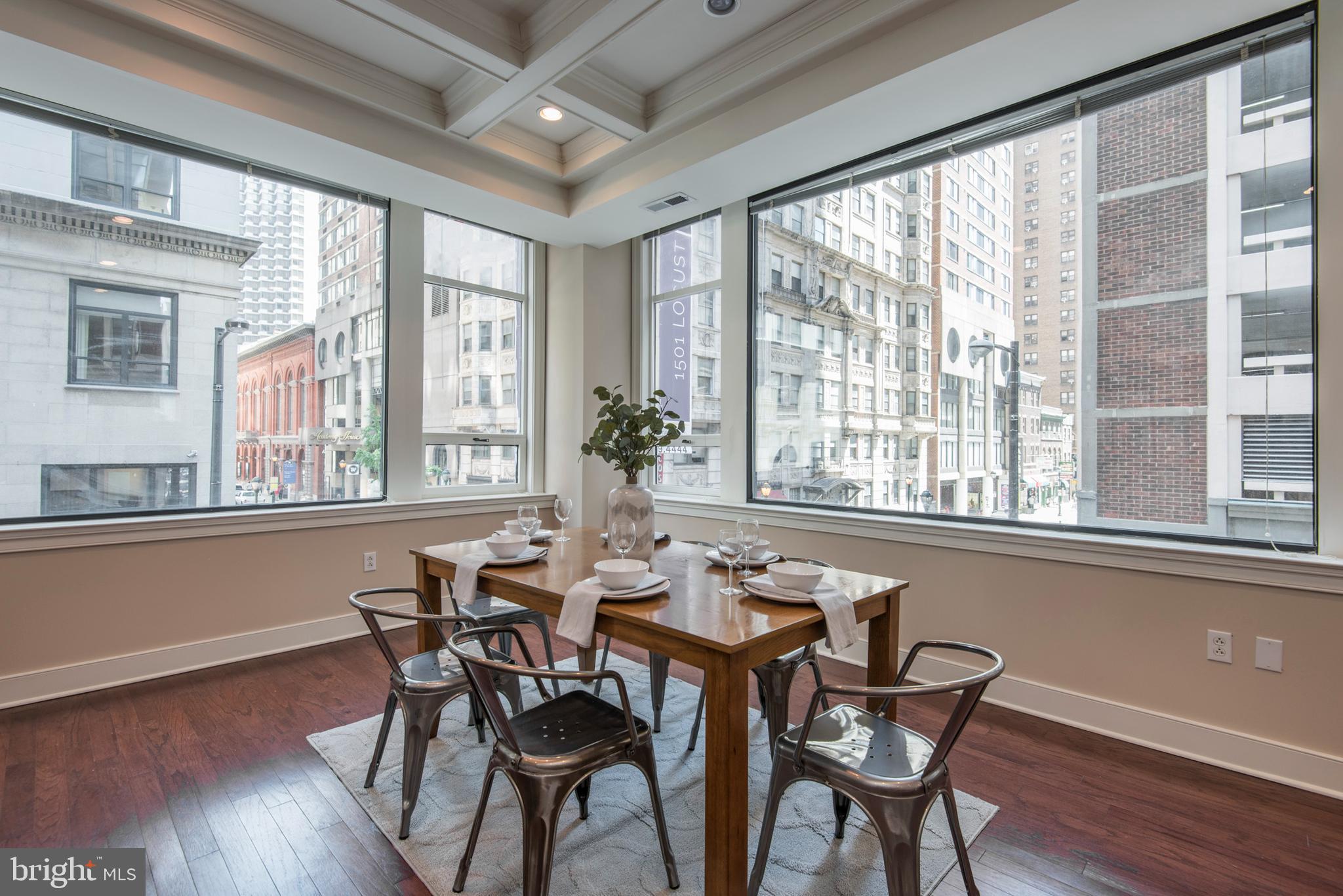 1501 Locust Street, Unit 403 Philadelphia, PA 19102 - Photo 12 of 23 a dining room with furniture window wooden floor