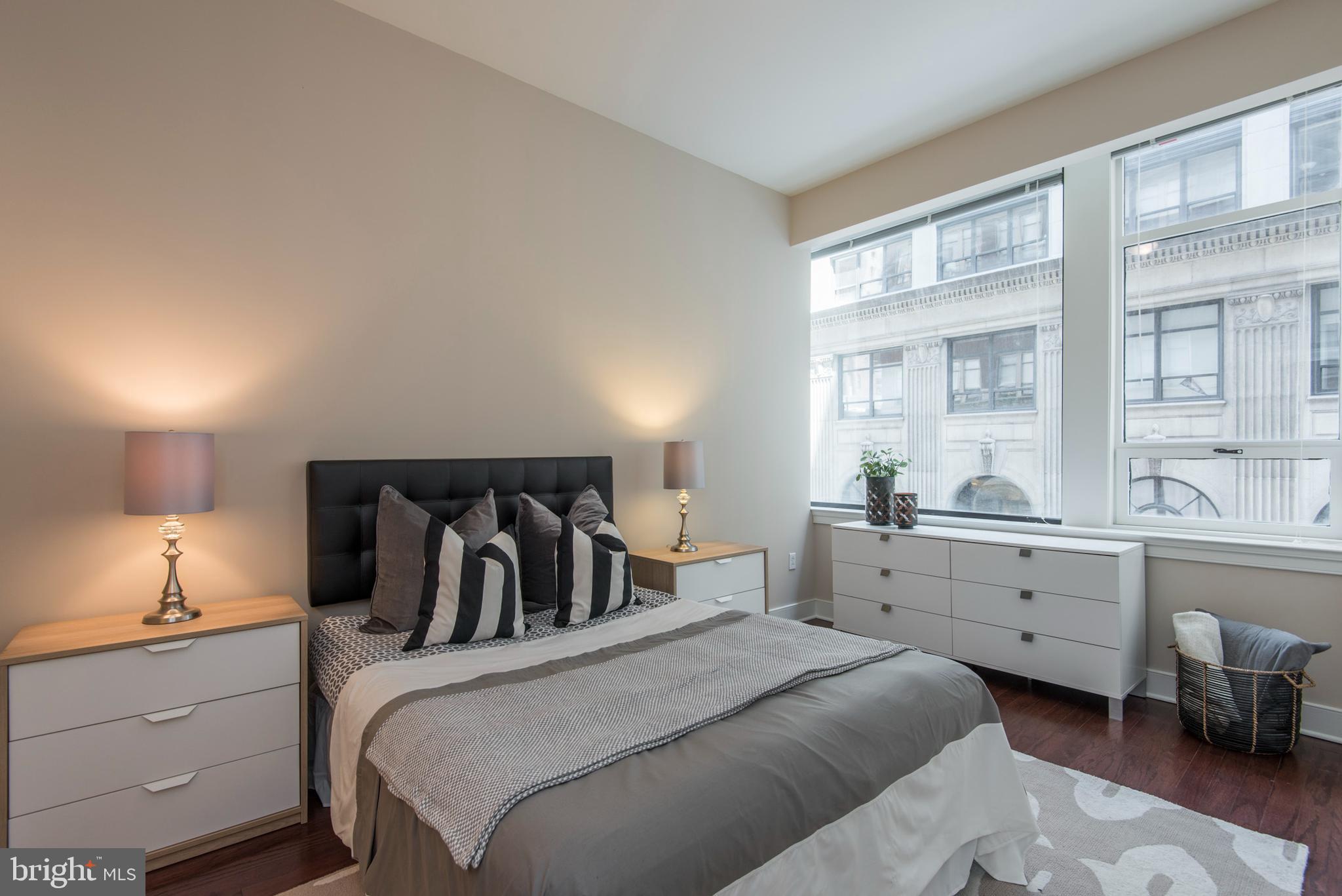 1501 Locust Street, Unit 403 Philadelphia, PA 19102 - Photo 15 of 23 a bedroom with a bed and window