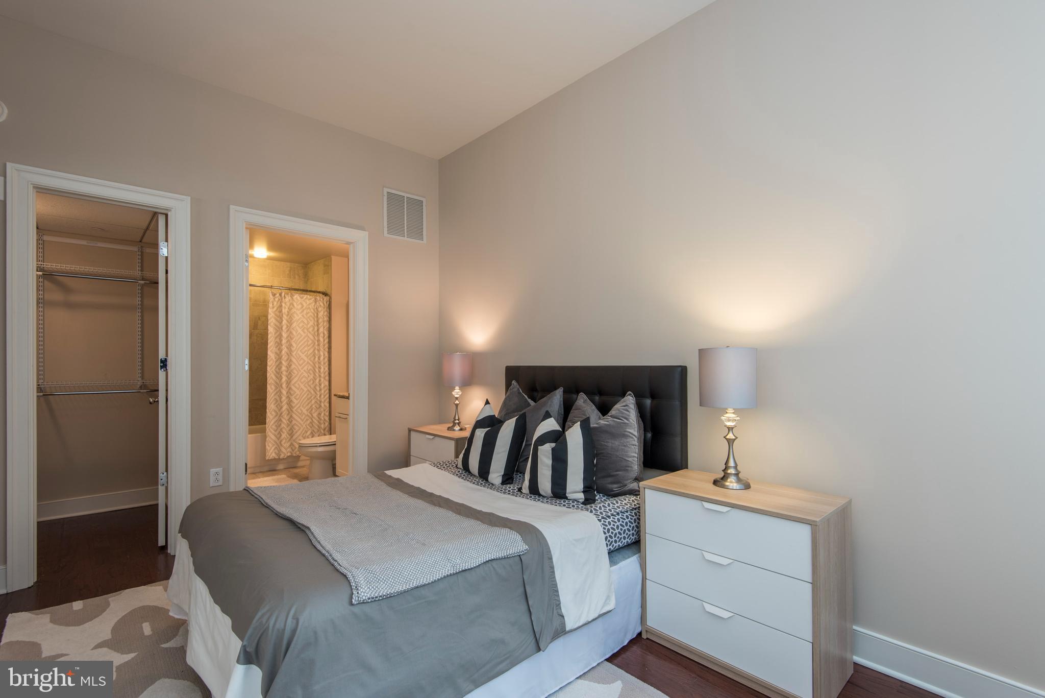 1501 Locust Street, Unit 403 Philadelphia, PA 19102 - Photo 16 of 23 a bedroom with a bed and a closet
