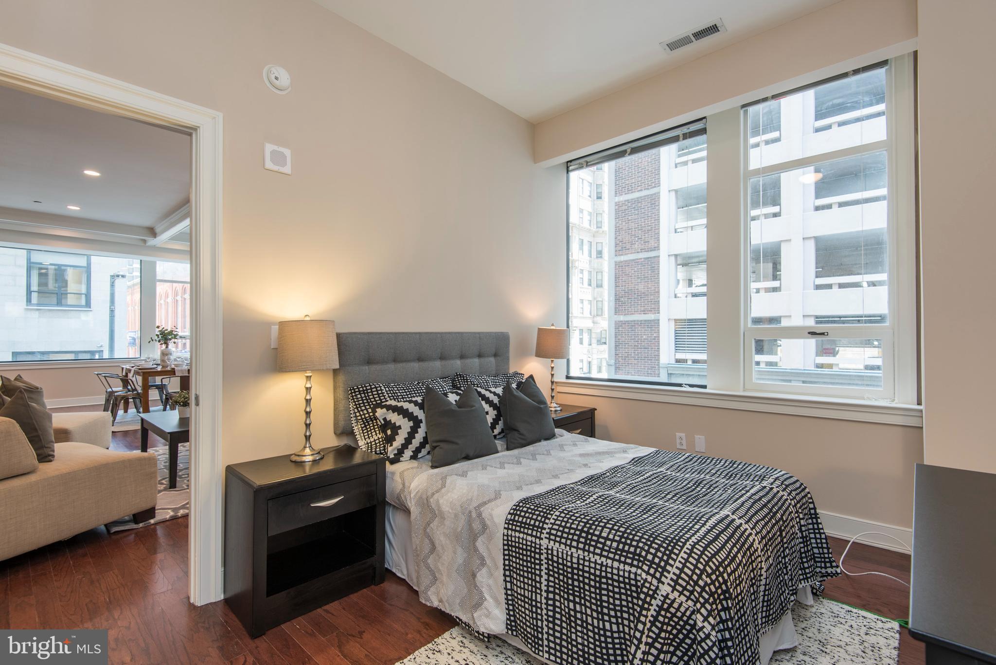 1501 Locust Street, Unit 403 Philadelphia, PA 19102 - Photo 19 of 23 a bedroom with a large bed and a window