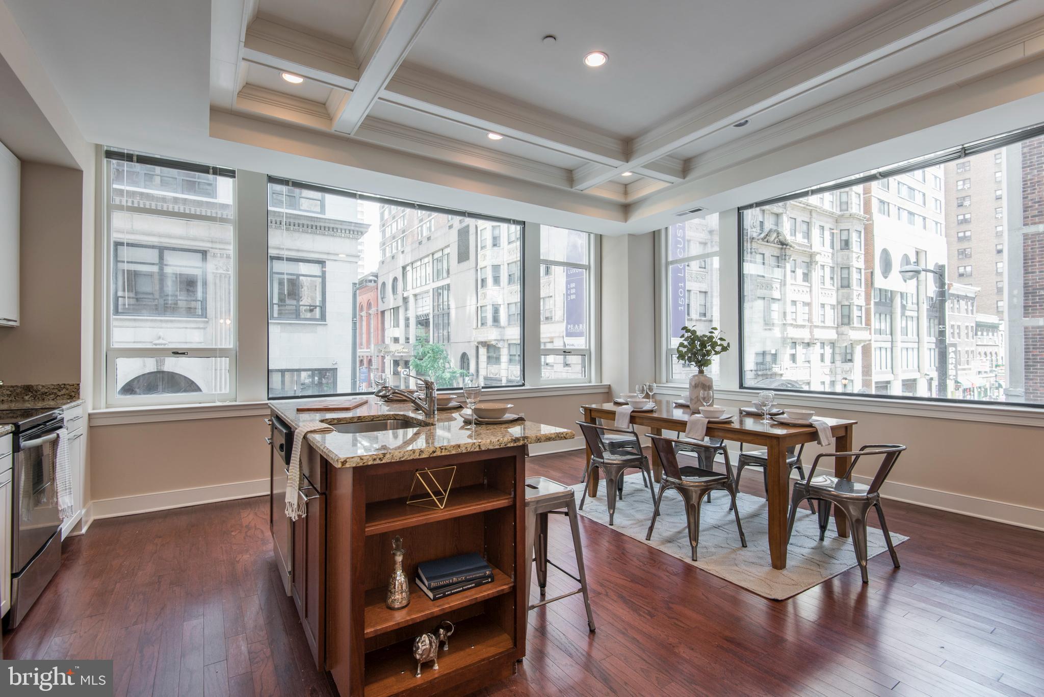 1501 Locust Street, Unit 403 Philadelphia, PA 19102 - Photo 3 of 23 a view of a dining room with furniture window and wooden floor