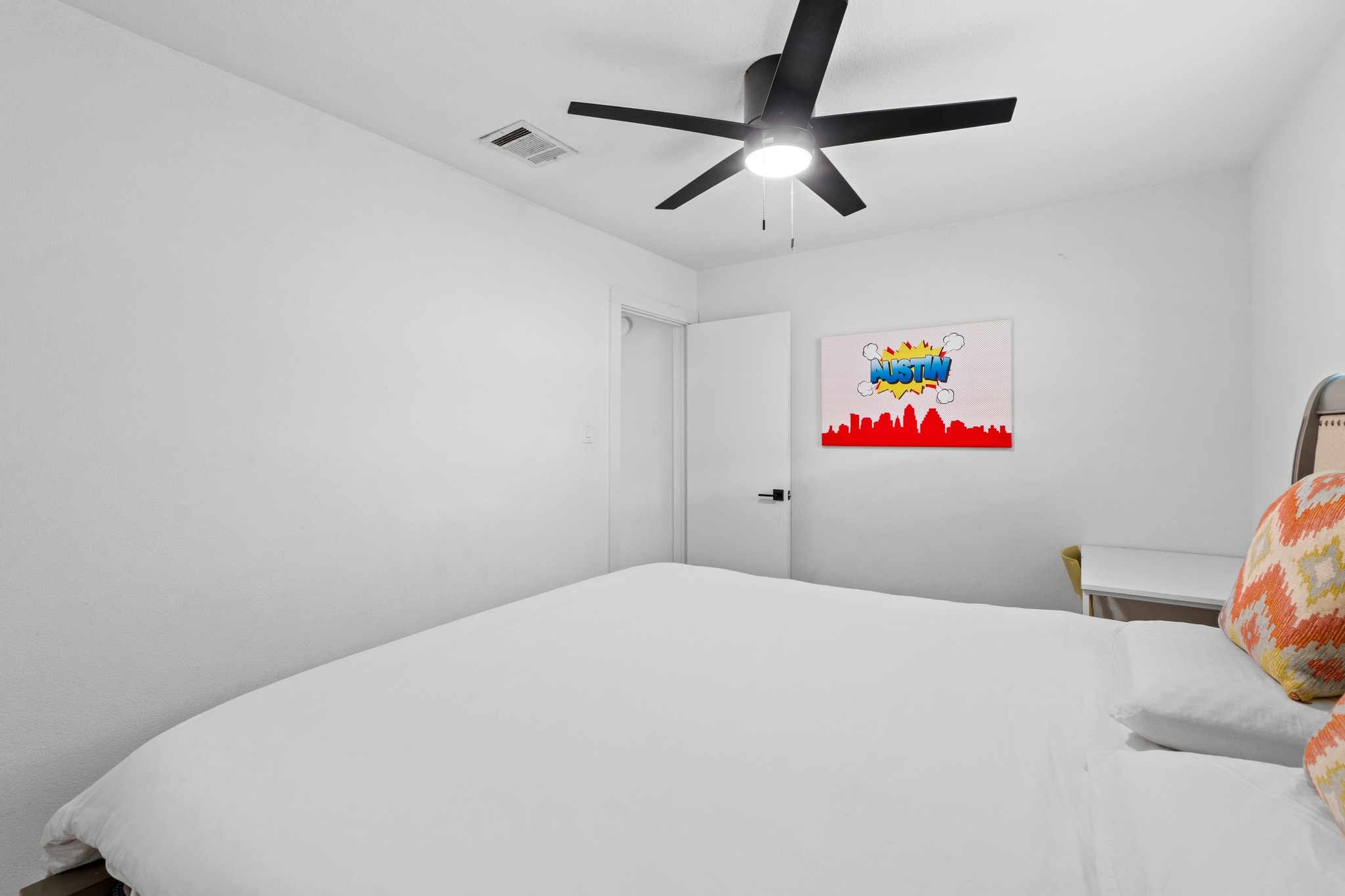 10601 Macmora Road, Unit B Austin, TX 78758 - Photo 13 of 22 A comfortable bedroom features a streamlined ceiling fan, offering refreshing airflow and a cool ambiance.