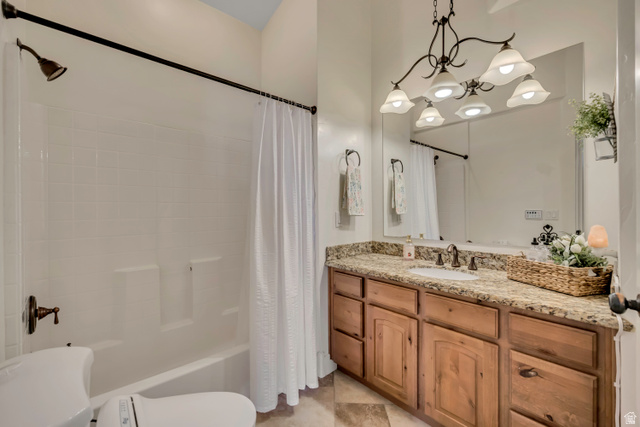3054 West Ridgeline Road Stockton, UT 84071 - Photo 26 of 88 Bathroom with vanity, shower / tub combo with curtain, and suspended lighting