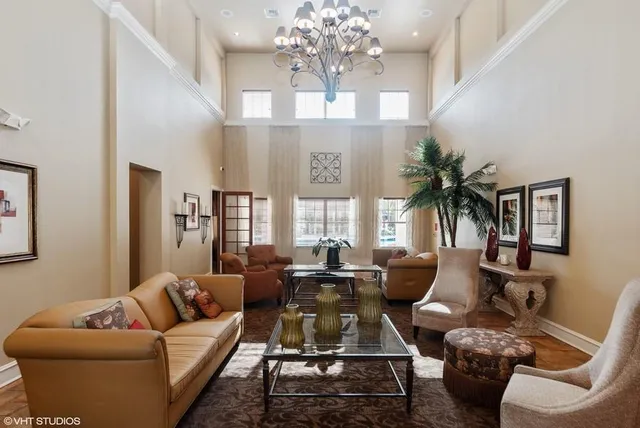 a room with pool table and windows