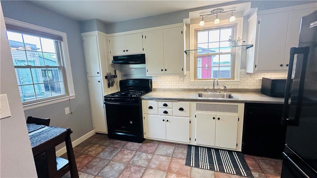 1414 Burtner Road Natrona Heights, PA 15065 - Photo 18 of 42 Kitchen with gas stove, dishwasher, microwave and refrigerator.