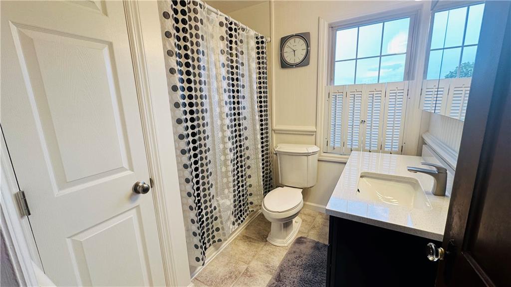 1414 Burtner Road Natrona Heights, PA 15065 - Photo 29 of 42 Full bathroom on upper level. Updated vanity and commode. Closet to left.