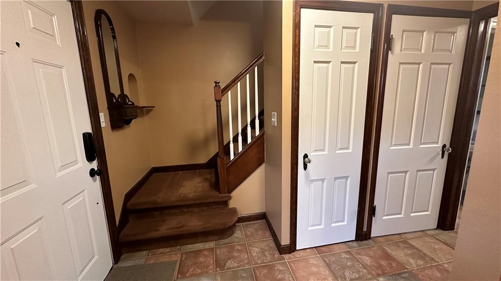 1414 Burtner Road Natrona Heights, PA 15065 - Photo 9 of 42 Entry closet. Door to lower level. Ceramic floor.