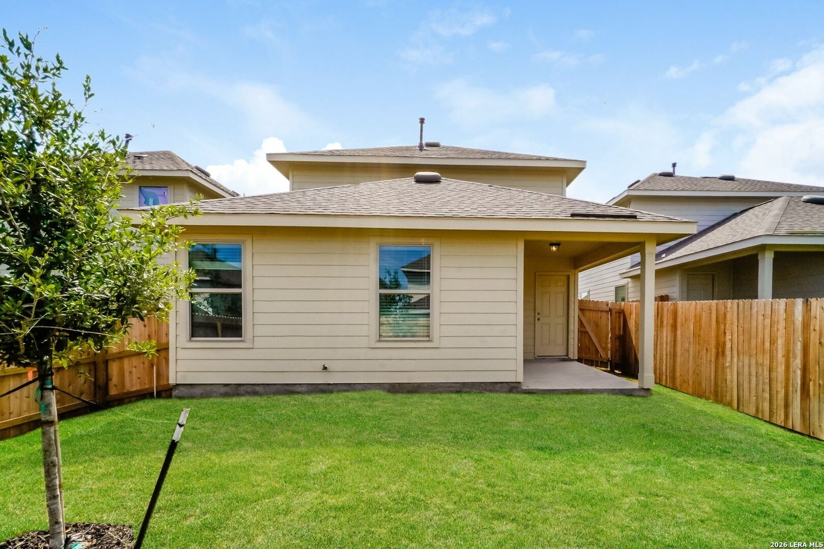 5018 Blue Ranch San Antonio, TX 78222 - Photo 2 of 17 a front view of a house with a garden