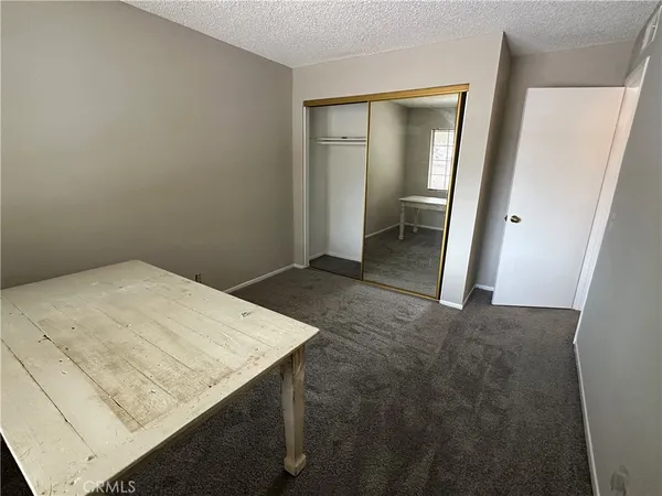 a utility room with cabinets washer and dryer