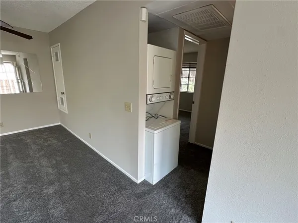 a view of storage and utility room with closet