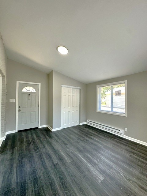 513 Cookane Avenue Elgin, IL 60120 - Photo 10 of 26 an empty room with wooden floor and windows