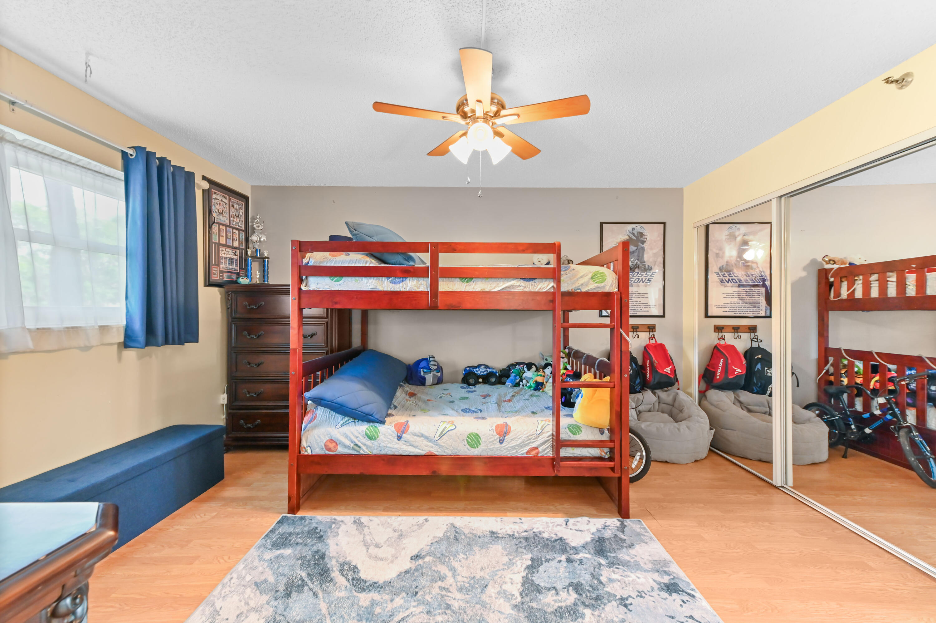 198 Northwest 67th Street, Unit 207 Boca Raton, FL 33487 - Photo 28 of 42 a bedroom with bunk beds and a window