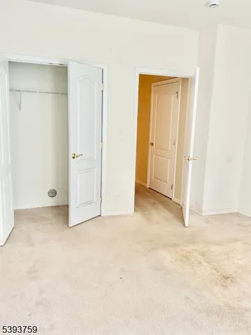 a bathroom with a toilet and a mirror