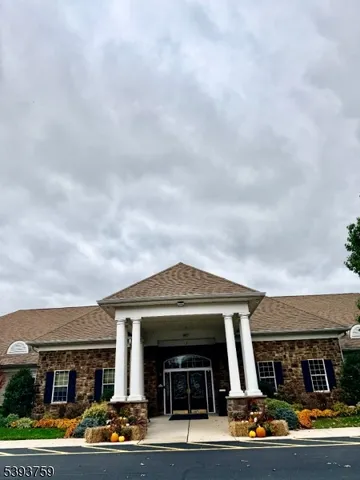 a view of a livingroom with furniture and a potted plant