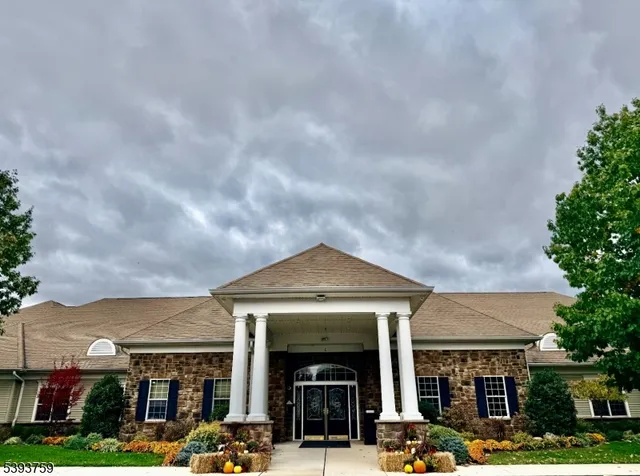 a front view of building with yard