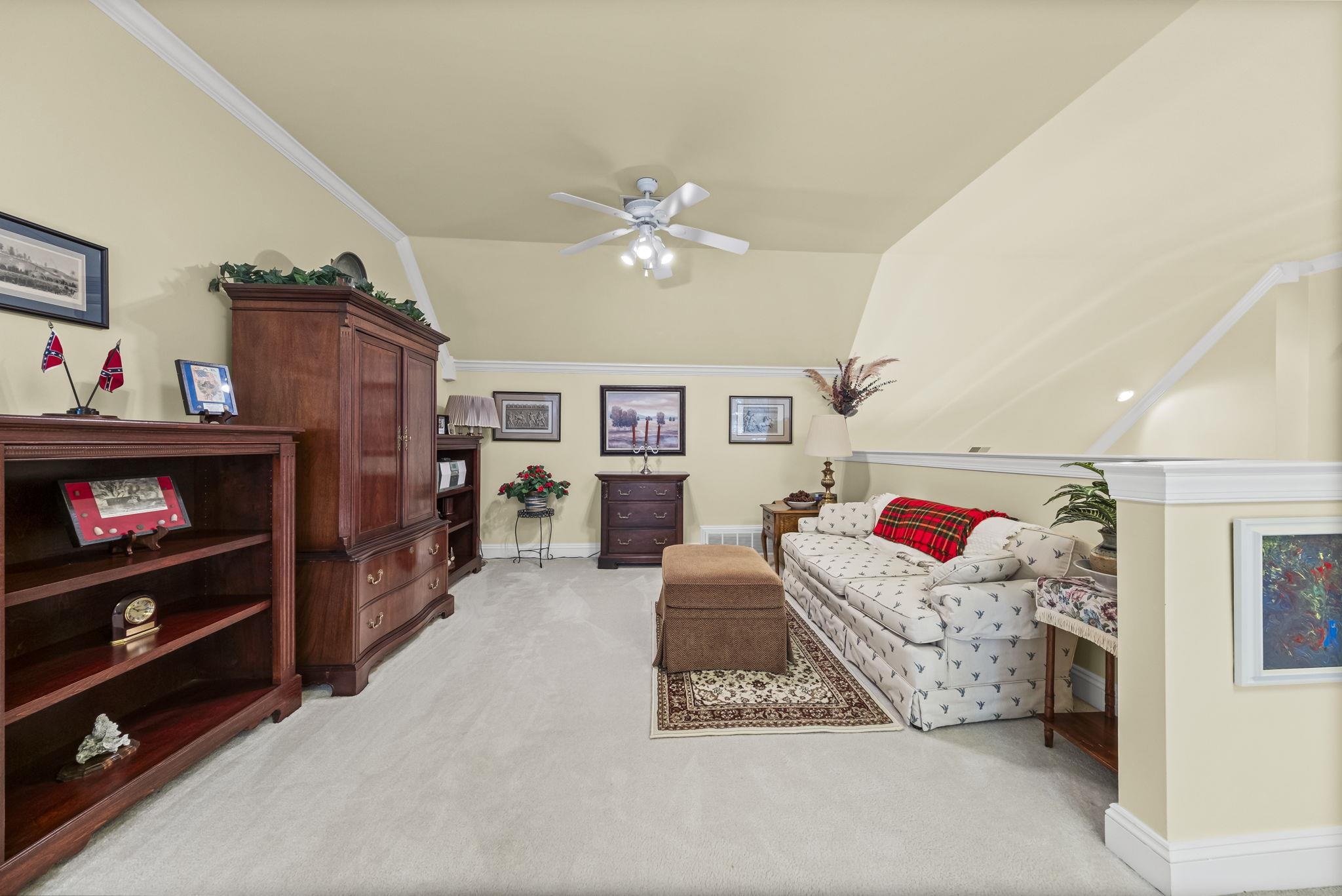 450 Cherry Road Eads, TN 38028 - Photo 6 of 24 Sitting room with light colored carpet, ornamental molding, and ceiling fan