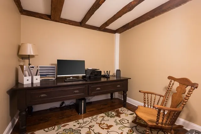 a view of a workspace with furniture