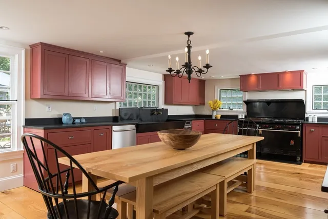 a kitchen with a dining table and chairs