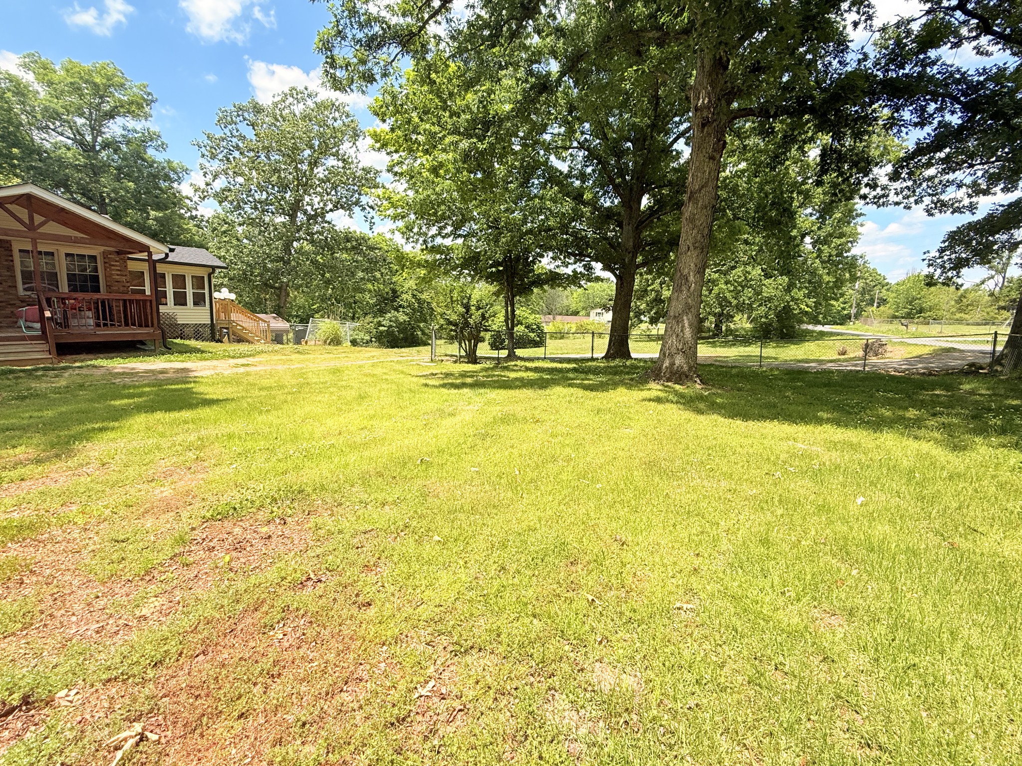 9092 East 40 Road Bon Aqua, TN 37025 - Photo 4 of 4 a view of swimming pool with lawn chairs and large trees
