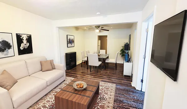 a living room with furniture and a flat screen tv