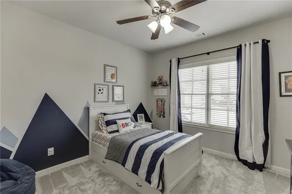 a bedroom with a bed and dresser