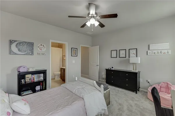 a bedroom with bed and window