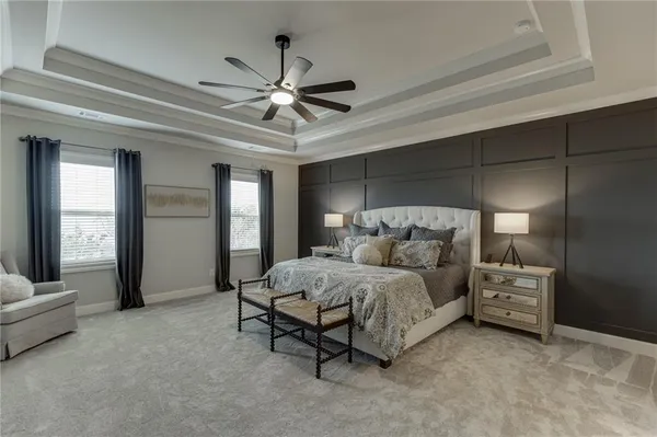 a bathroom with a granite countertop double vanity sink and a mirror