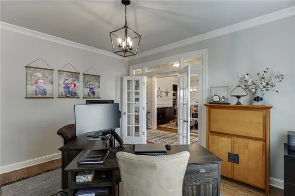 a view of a livingroom with furniture and a chandelier