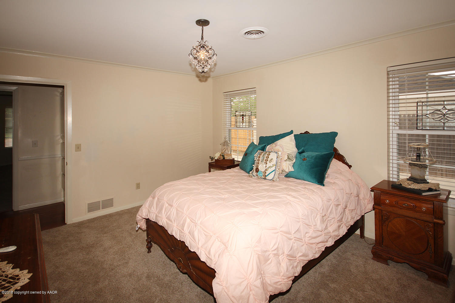 6311 Elmhurst Road Amarillo, TX 79106 - Photo 23 of 38 a bedroom with bed and window