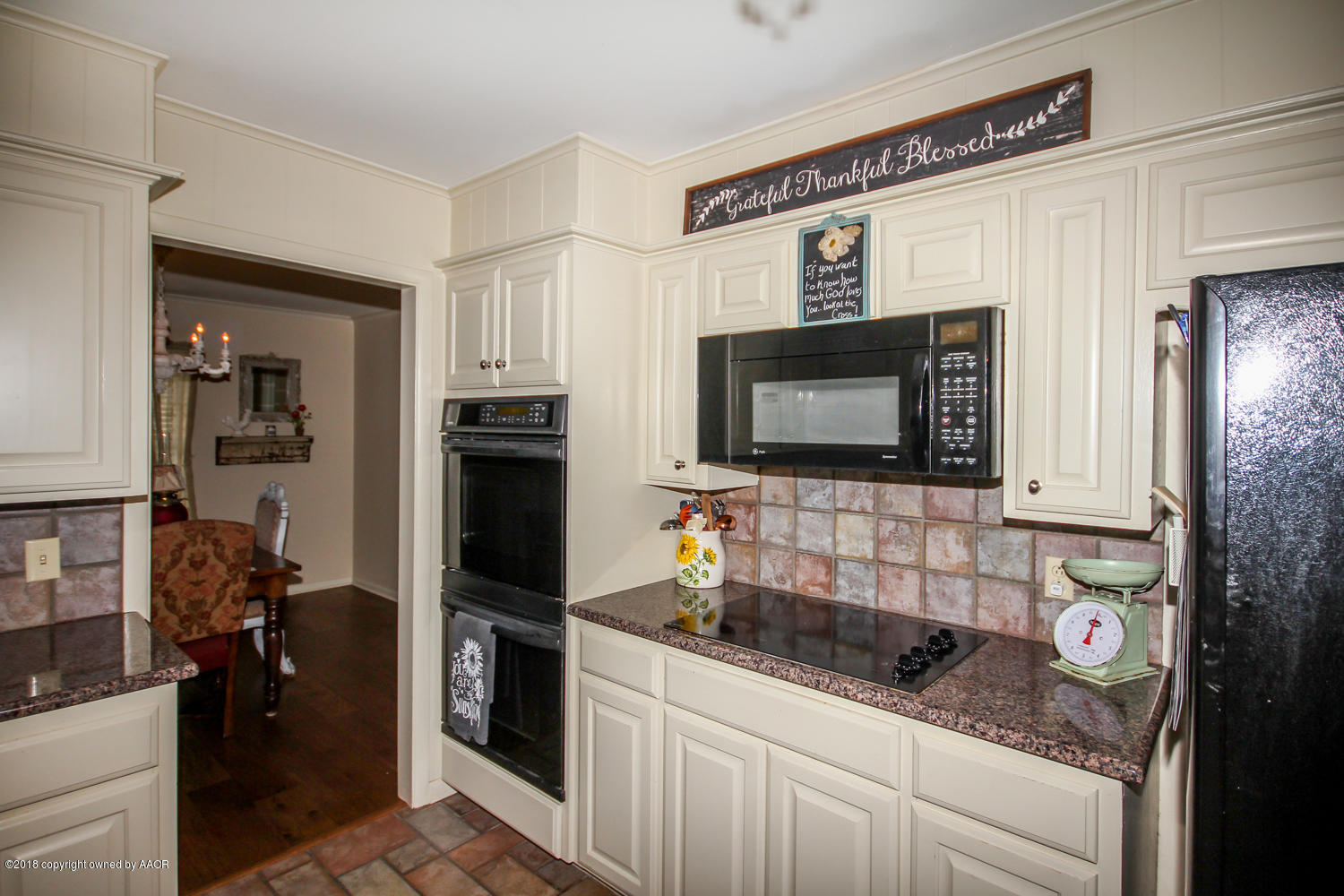 6311 Elmhurst Road Amarillo, TX 79106 - Photo 9 of 38 a kitchen with stainless steel appliances granite countertop a sink stove and refrigerator