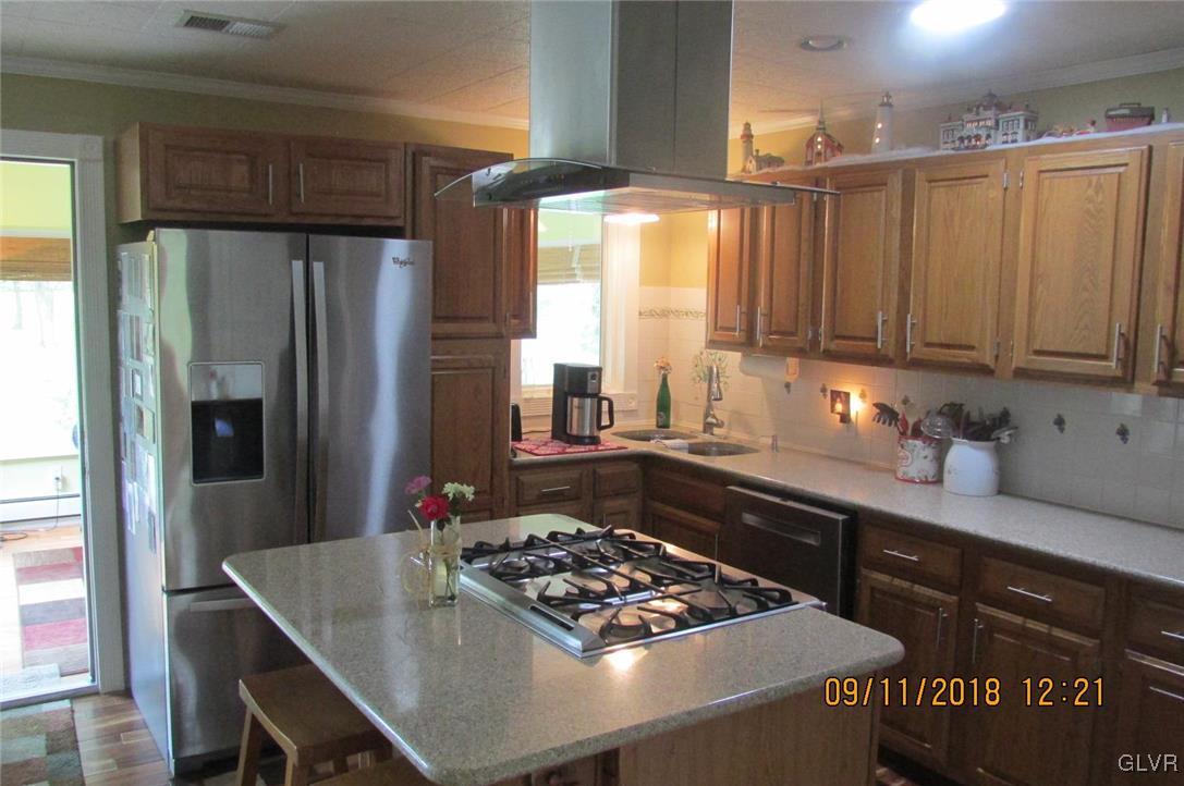 6080 Little Gap Road Kunkletown, PA 18058 - Photo 12 of 43 a kitchen with a refrigerator and a sink