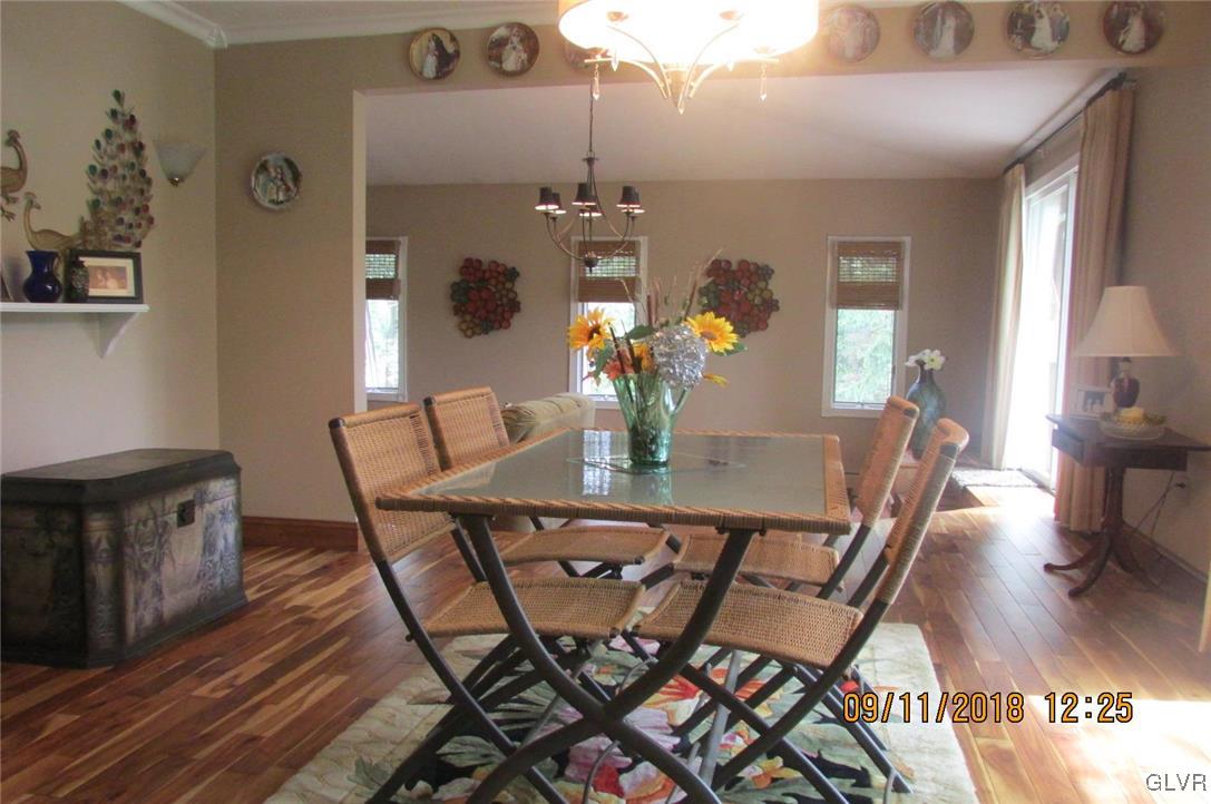 6080 Little Gap Road Kunkletown, PA 18058 - Photo 6 of 43 a view of a dining room with furniture a chandelier and wooden floor