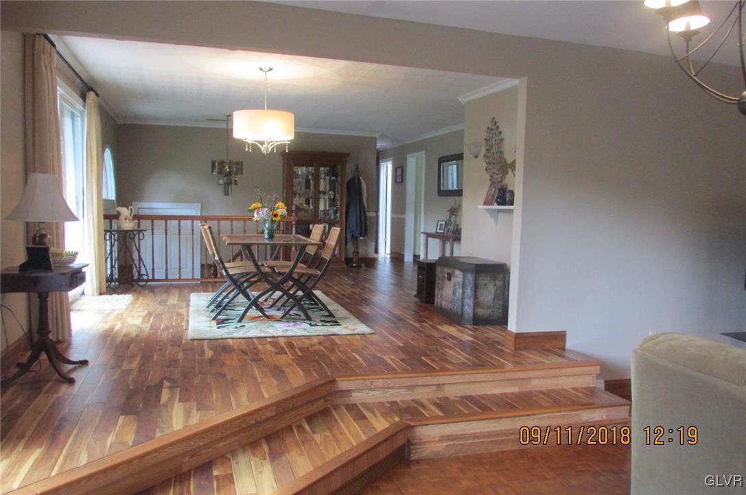 6080 Little Gap Road Kunkletown, PA 18058 - Photo 8 of 43 a view of a dining room with furniture a chandelier and wooden floor