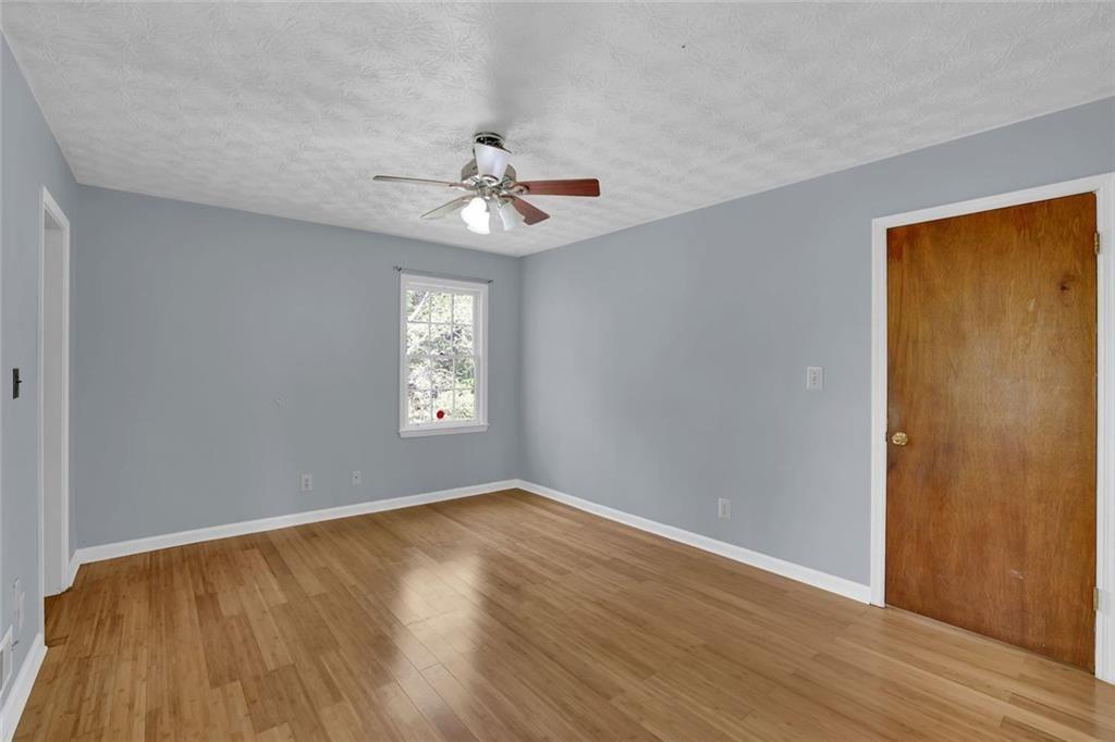 4341 Five Forks Trickum Road Southwest Lilburn, GA 30047 - Photo 13 of 35 a view of entryway with wooden floor