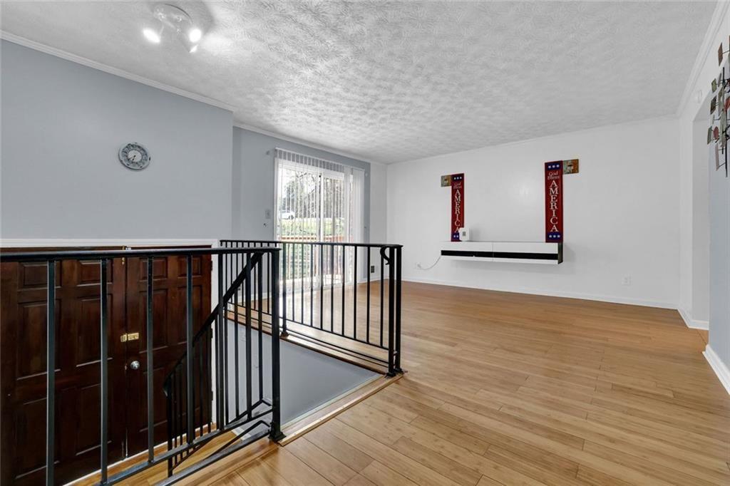 4341 Five Forks Trickum Road Southwest Lilburn, GA 30047 - Photo 18 of 35 a view of hallway with wooden floor