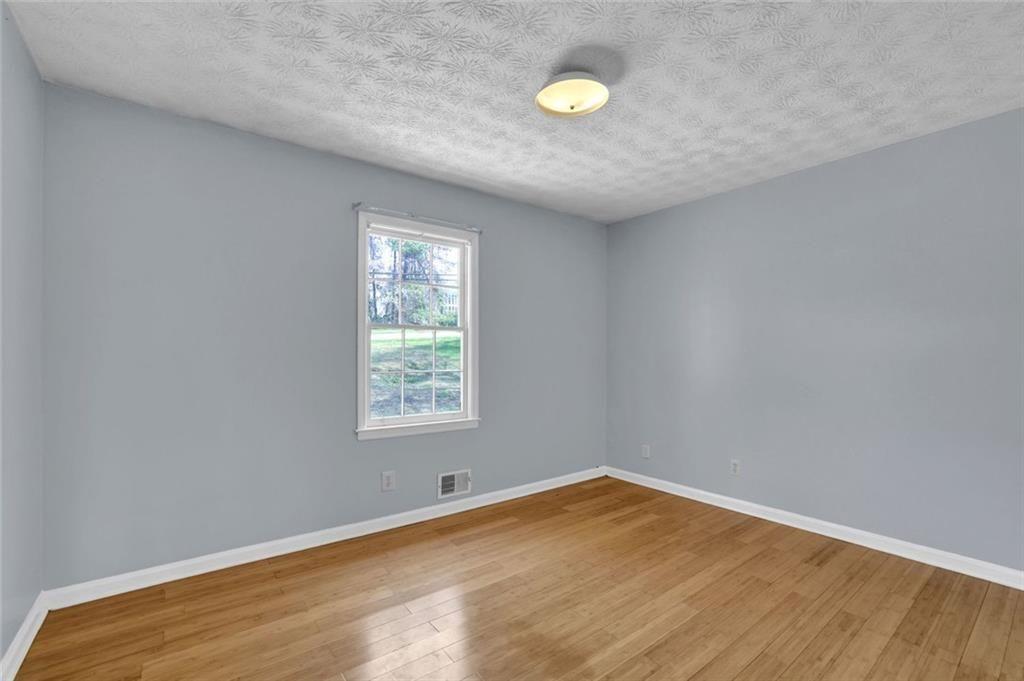 4341 Five Forks Trickum Road Southwest Lilburn, GA 30047 - Photo 19 of 35 an empty room with a window