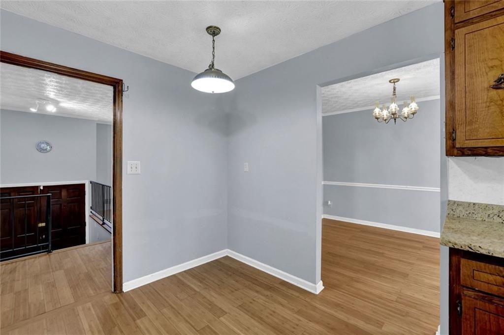 4341 Five Forks Trickum Road Southwest Lilburn, GA 30047 - Photo 21 of 35 a view of a livingroom with wooden floor