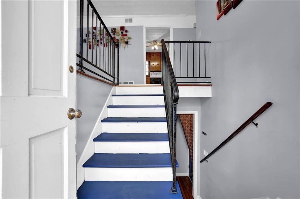 4341 Five Forks Trickum Road Southwest Lilburn, GA 30047 - Photo 22 of 35 a view of entryway with wooden floor