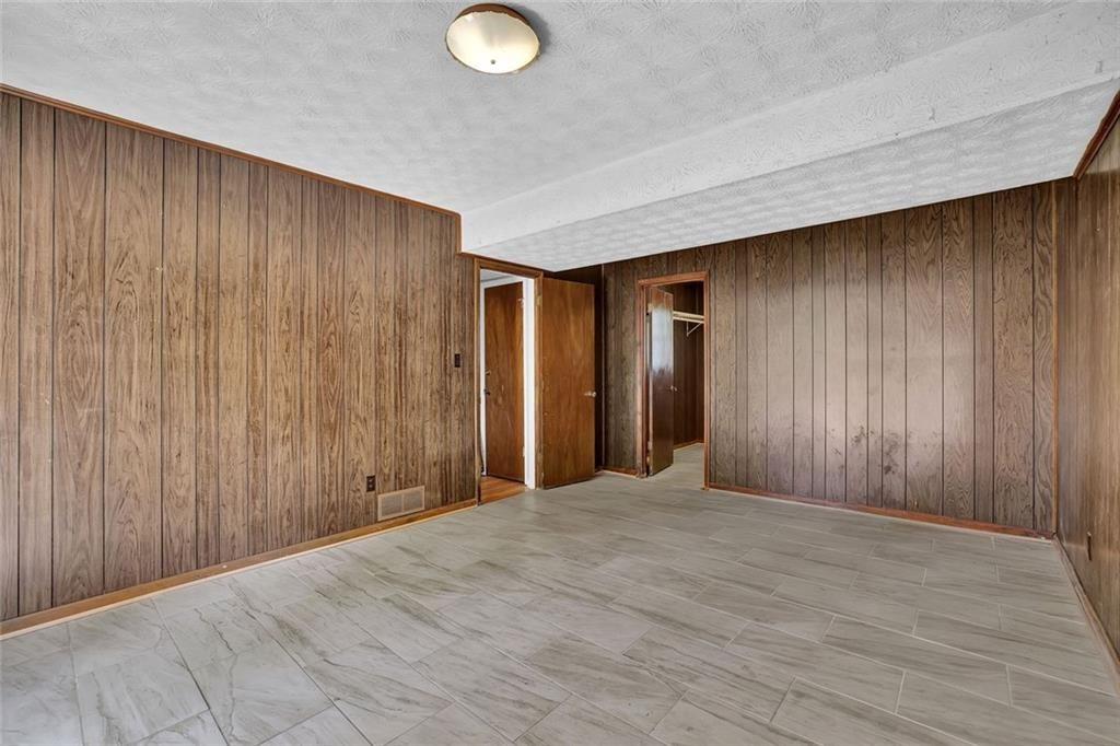 4341 Five Forks Trickum Road Southwest Lilburn, GA 30047 - Photo 23 of 35 a view of a livingroom with wooden floor