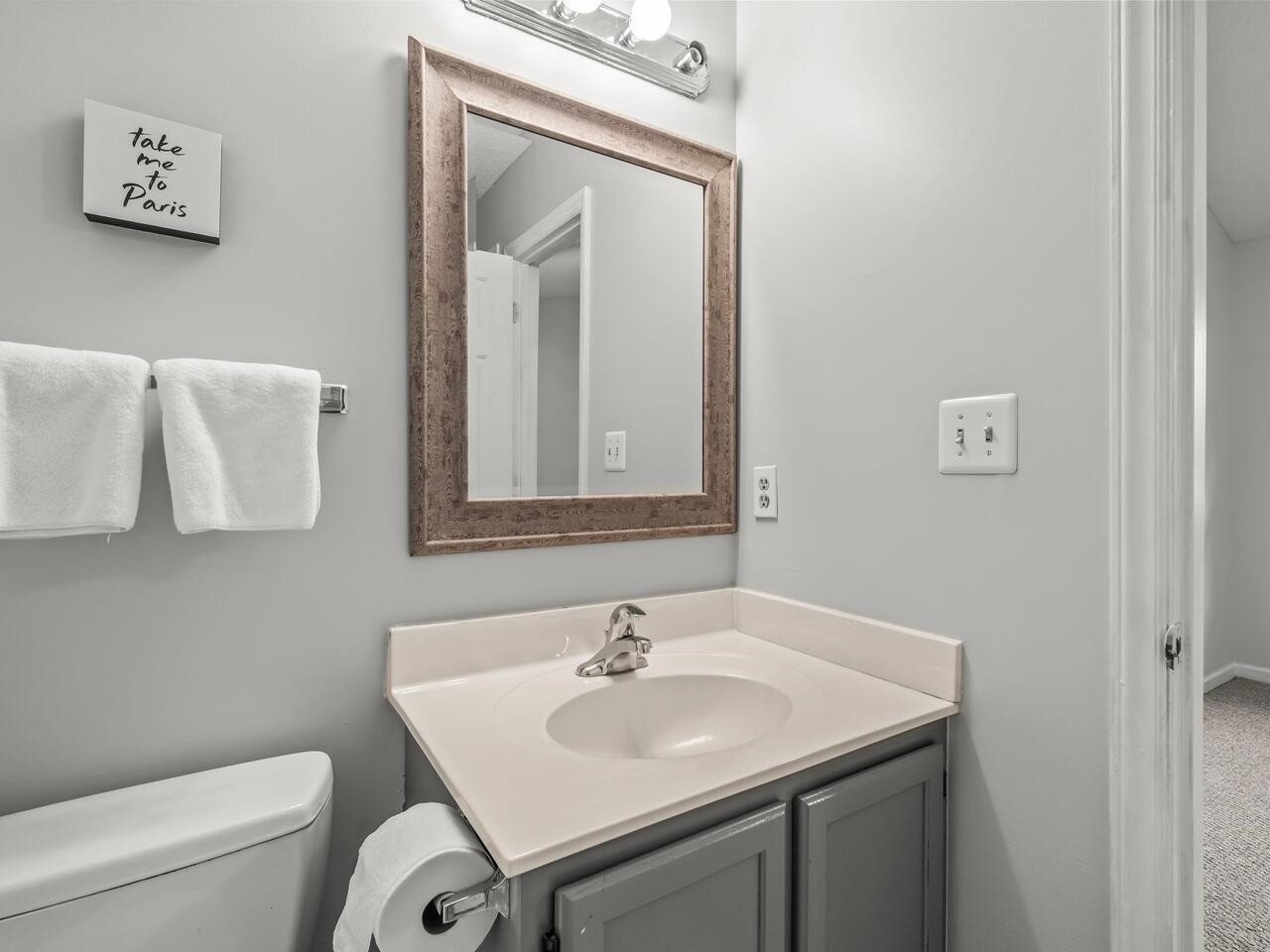 118 Shady Spring Place Durham, NC 27713 - Photo 17 of 33 a bathroom with a toilet sink and mirror