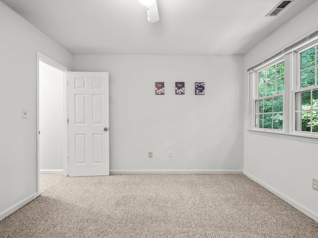 118 Shady Spring Place Durham, NC 27713 - Photo 19 of 33 an empty room with windows